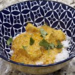 Katie's Chicken Curry on a bed of rice, garnished with cilantro